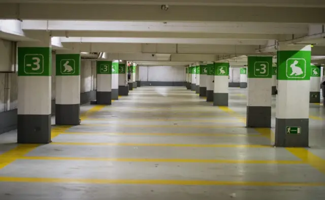 An empty underground parking lot in one of the busiest parts of Brussels stays empty