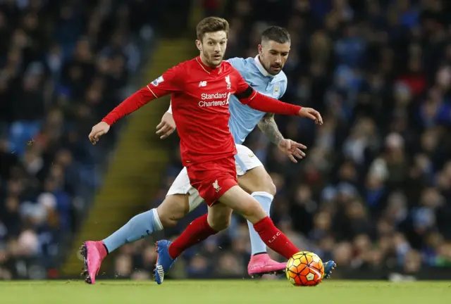 Adam Lallana looks for the pass alongside Aleks Kolorov