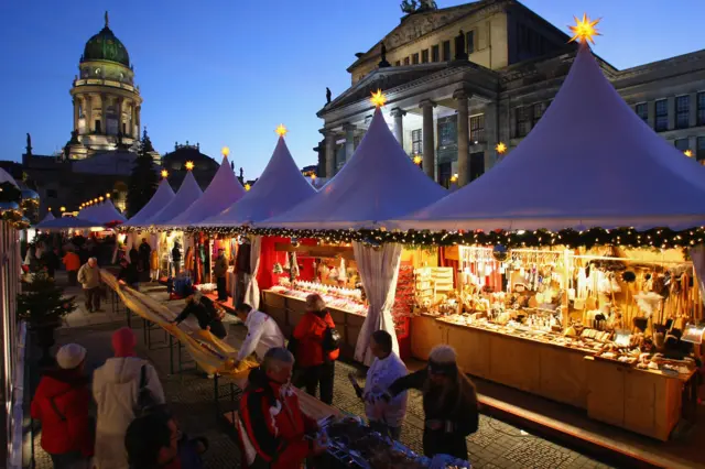 People shop at a Christmas market in Berlin