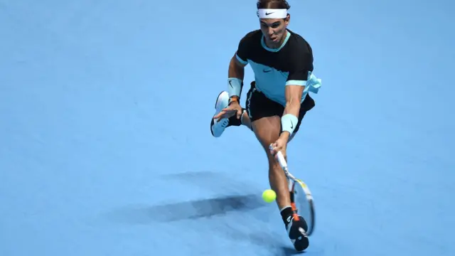 Rafael Nadal hits a return