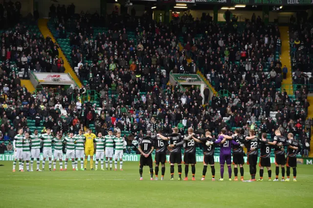 Celtic and Kilmarnock players observe a minute's silence