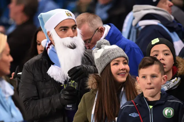 A Manchester City fan dressed as Santa Claus