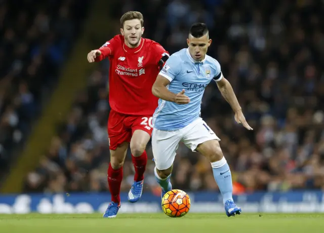 Sergio Aguero charges forward with the ball