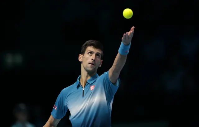 Novak Djokovic serves