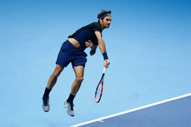 Roger Federer serves