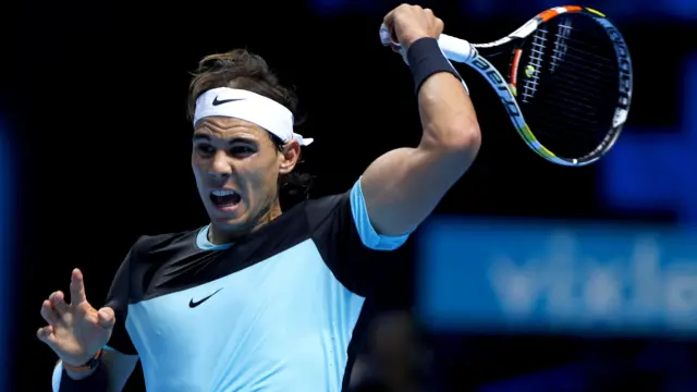 Rafael Nadal plays a forehand