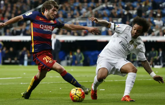 Sergi Roberto is challenged by Marcello