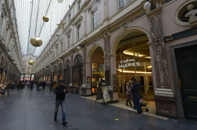 A man walks at the Galerie de la Reine near the Grand Place in Brussels