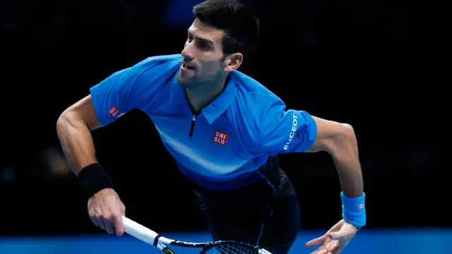 Novak Djokovic serves