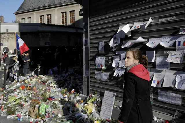 A woman walks past the Petit Cambodge in Paris