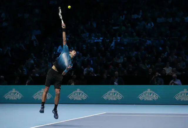 Novak Djokovic serves