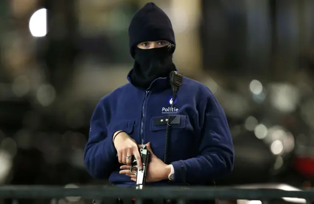 An armed female Belgian police officer during a continued high level of security