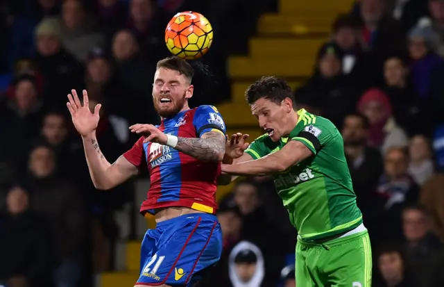 Conor Wickham rises for the header