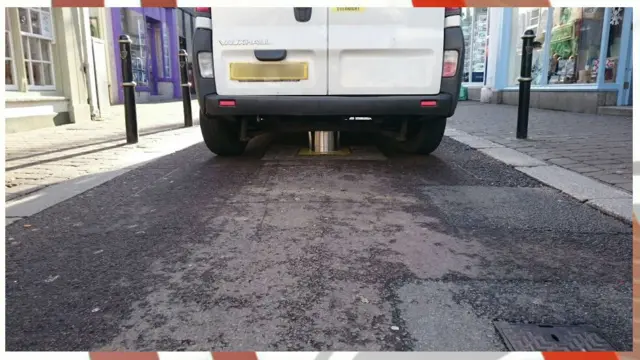 Van stuck on bollard