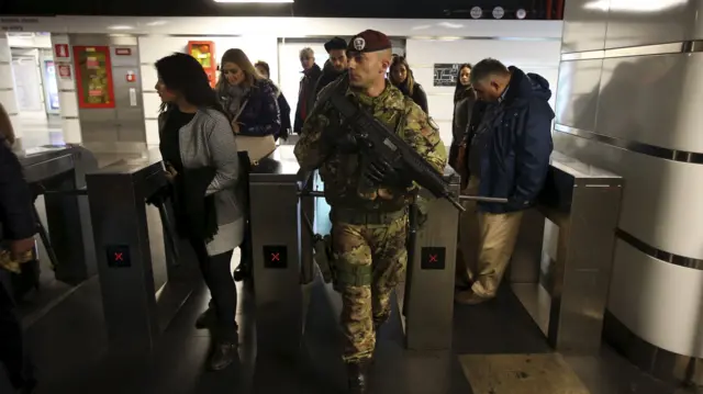 An Italian soldier patrols at the Termini train station in downtown Rome