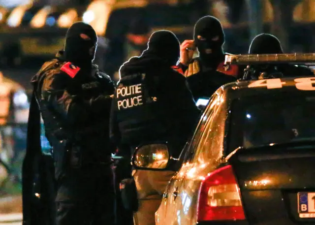 Belgian special police forces take part in an operation in the neighbourhood of Molenbeek in Brussels, Belgium, November 22, 2015