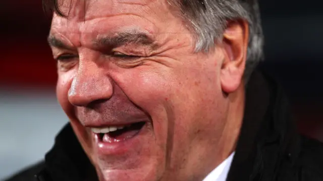 Sam Allardyce laughs in the dugout