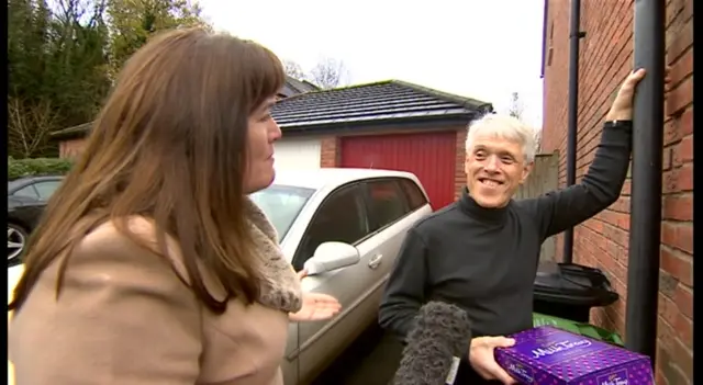 Midlands Today's reporter Joan Cummins and would-be Milk Tray man Phillip Howells