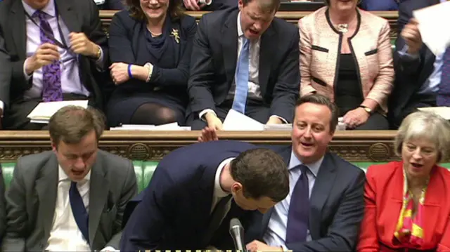 David Cameron pats George Osborne on the back