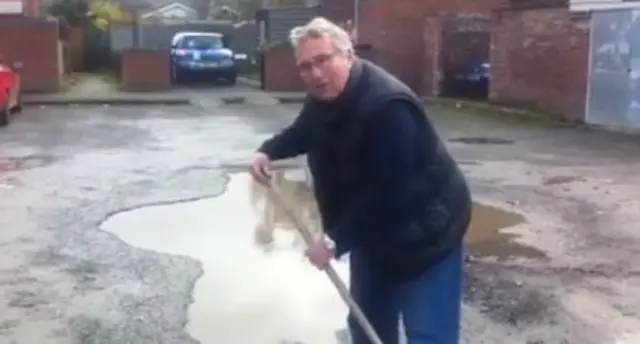 Councillor Rumsey sweeps potholes