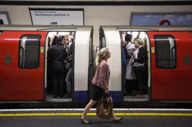 Tube train and passengers