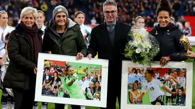 Helmut Sandrock, general secretary of DFB and head coach Silvia Neid of Germany say farewell to Nadine Angerer and Celia Sasic