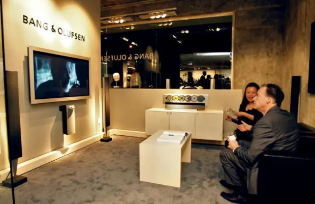 Guests look at TVs at a Bang & Olufsen marketing event