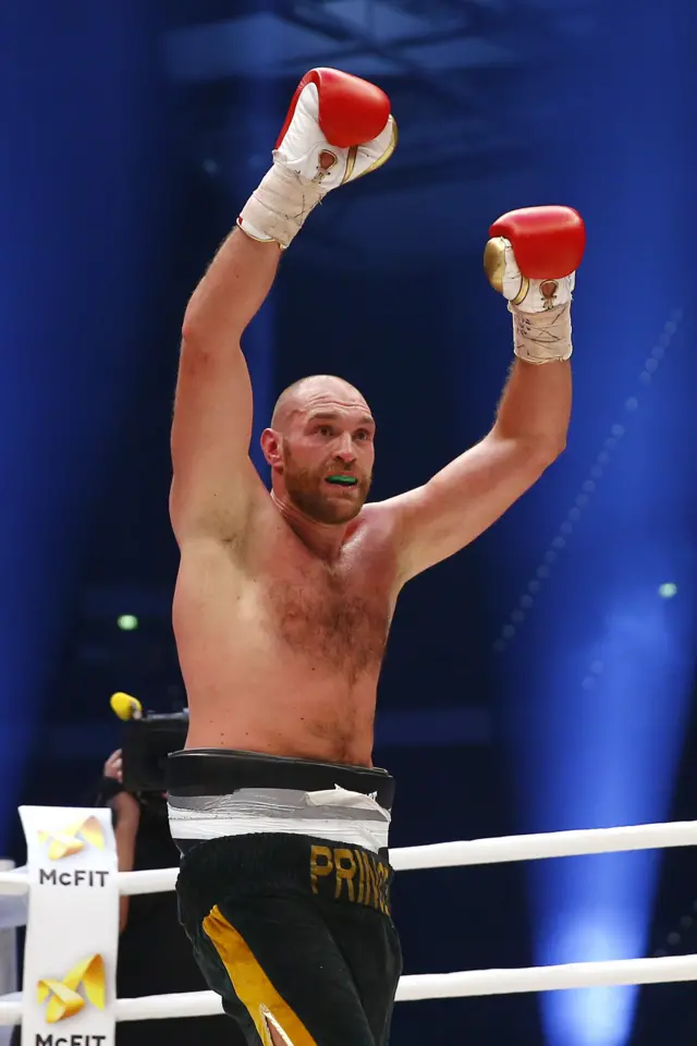 Tyson Fury hands up