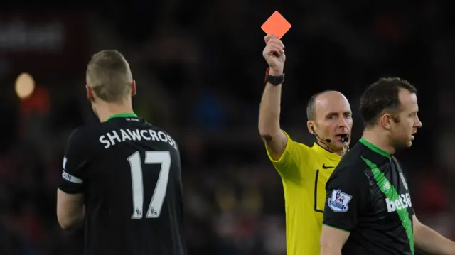 Ryan Shawcross is shown a red card