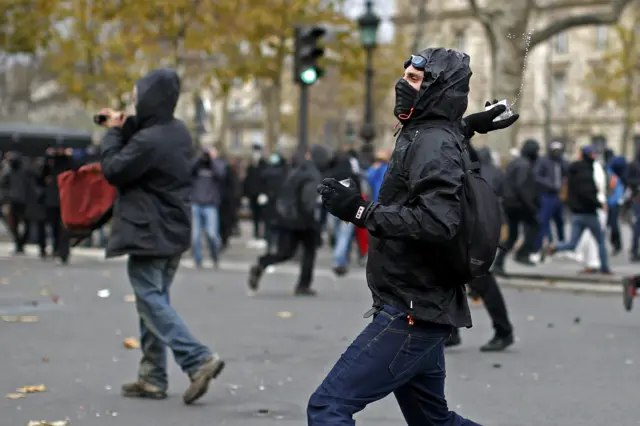 Protester throwing an object