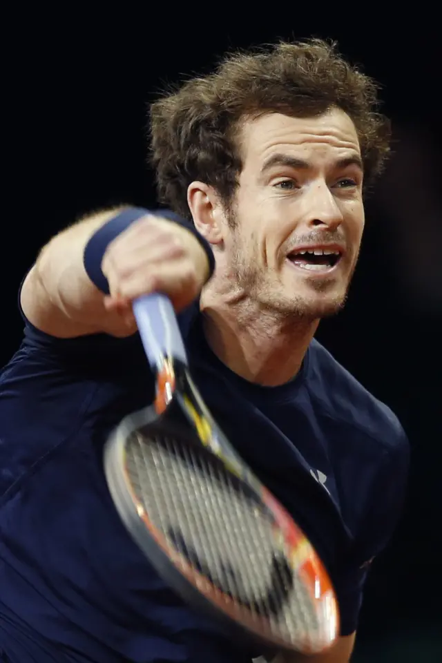 Andy Murray serves