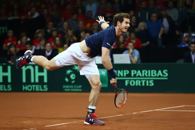 Andy Murray serves