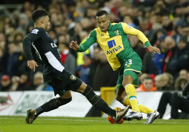 Norwich's Martin Olsson tries to beat Arsenal's Alex Oxlade-Chamberlain