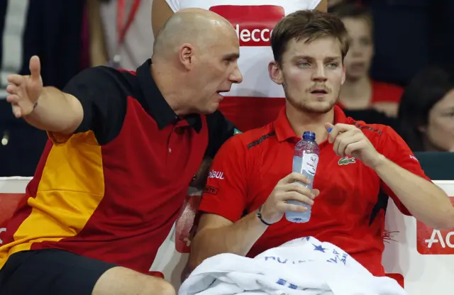 David Goffin has a drink during a break in play