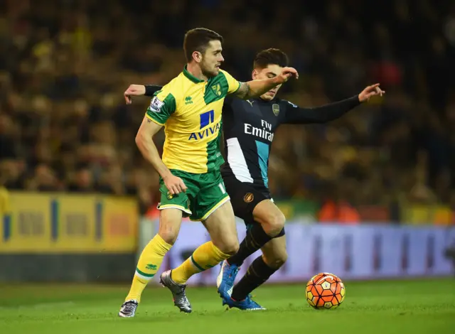 Norwich's Robbie Brady challenges Arsenal's Hector Bellerin