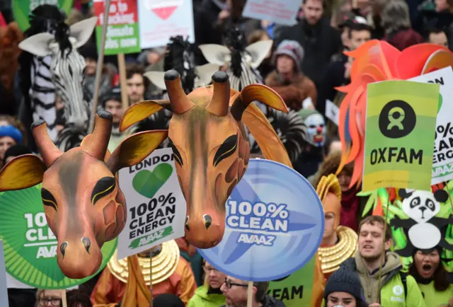 Protest signs and puppets in London