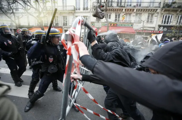 Riot police clash with protesters