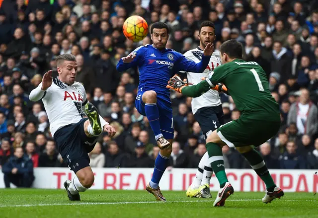 Pedro of Chelsea is marshalled by Toby Alderweireld (L), Mousa Dembele (2R) and goalkeeper Hugo Lloris