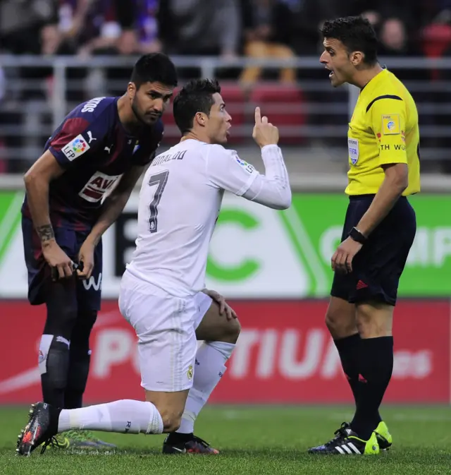 Cristiano Ronaldo argues with the referee