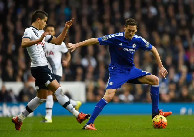 Nemanja Matic of Chelsea holds off Erik Lamela