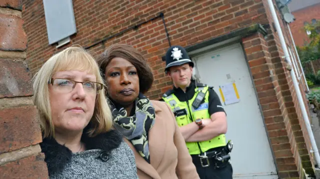Jo Mason from Wolverhampton's Anti-Social Behaviour Team, Councillor Sandra Samuels, the City of Wolverhampton Council's Cabinet Member for Public Health and Wellbeing, and PC Jonathan Peters from West Midlands Police outside the property in Parkfields which has been closed down.