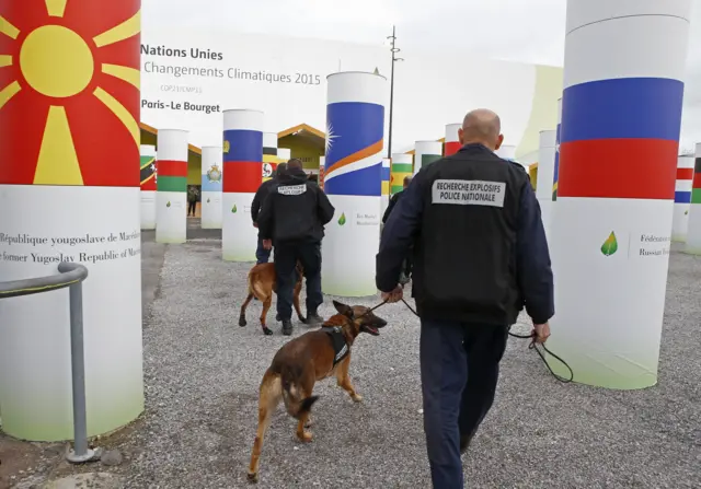 Policemen and dogs at the conference centre