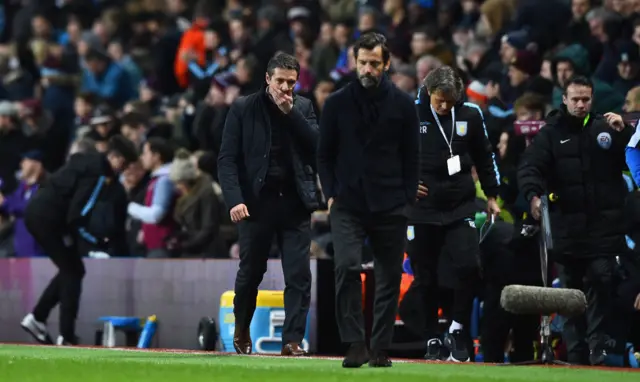 Villa manager Remi Garde (l) reacts as he leaves the pitch at half time behind Watford manager Quique Sanchez Flores during the Barclays Premier League match between Aston Villa and Watford at Villa Park on November 28