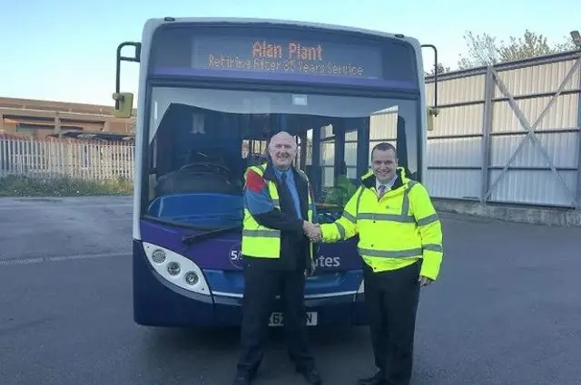 Bus driver outside bus