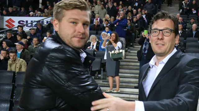 Karl Robinson (left) with Charlton's Karel Fraeye