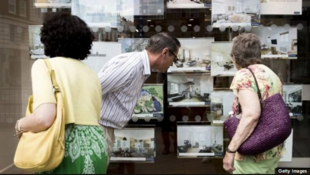 People looking into a shop window