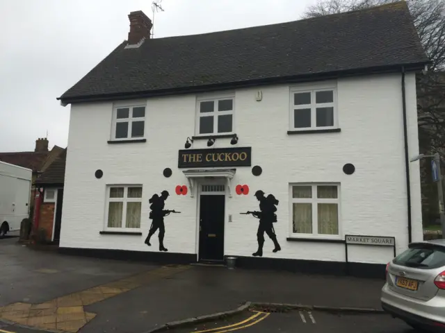 The Cuckoo Pub in Toddington with poppies and soldiers on the front