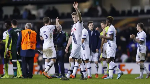 Eric Dier waves to fans at the end of the match