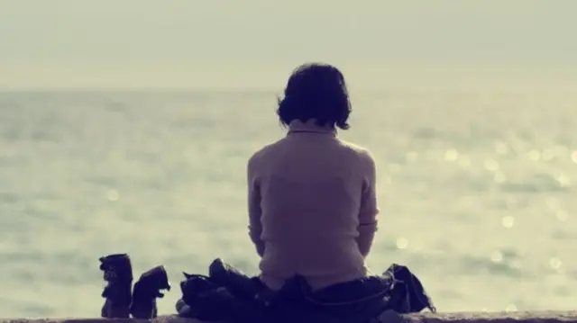 Women sitting on beach