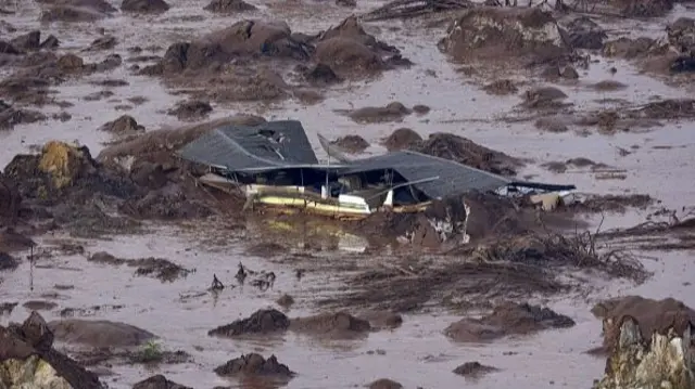 A submerged house from a burst dam in Brazil, 6th Nov '15